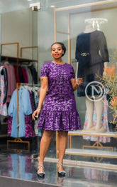 Elegant purple shift dress with ruffled hem